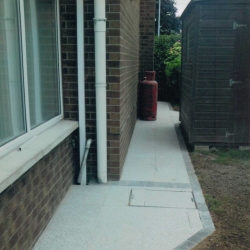 Granite paving with grey brick border - Belfast